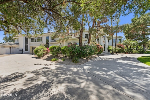 6467 E Sierra Vista Dr, Paradise Valley, AZ 85253 - view of front of house featuring fence, stucco siding, and driveway
