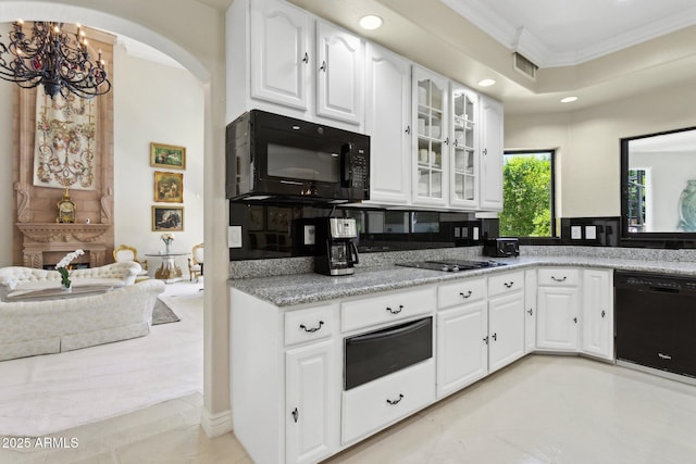 6467 E Sierra Vista Dr, Paradise Valley, AZ 85253 - kitchen with crown molding, arched walkways, black appliances, visible vents, and a warming drawer
