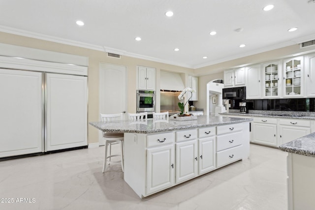 6467 E Sierra Vista Dr, Paradise Valley, AZ 85253 - kitchen featuring a kitchen island, black microwave, crown molding, marble finish floor, and recessed lighting
