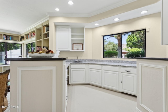 6467 E Sierra Vista Dr, Paradise Valley, AZ 85253 - kitchen with crown molding, white cabinets, open shelves, recessed lighting, and a wealth of natural light