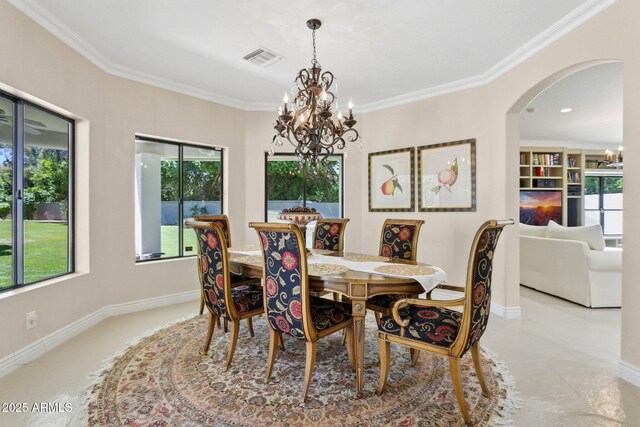 6467 E Sierra Vista Dr, Paradise Valley, AZ 85253 - dining room with an inviting chandelier, arched walkways, crown molding, and visible vents