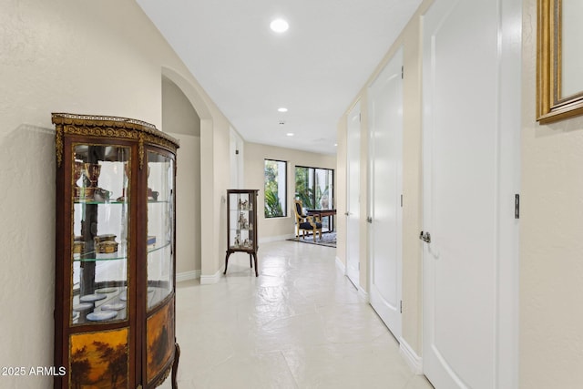 6467 E Sierra Vista Dr, Paradise Valley, AZ 85253 - hallway featuring arched walkways, baseboards, and recessed lighting
