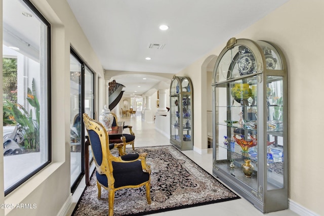 6467 E Sierra Vista Dr, Paradise Valley, AZ 85253 - hallway with visible vents, baseboards, ornate columns, recessed lighting, and arched walkways