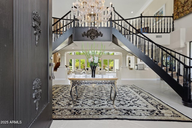 6467 E Sierra Vista Dr, Paradise Valley, AZ 85253 - entryway with decorative columns, a towering ceiling, and stairs