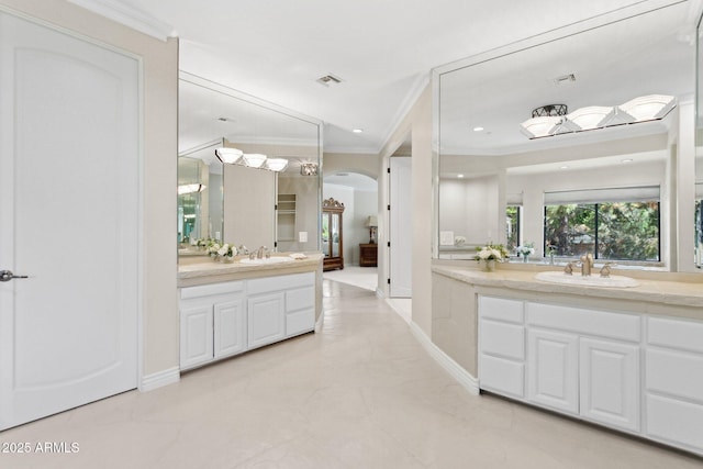 6467 E Sierra Vista Dr, Paradise Valley, AZ 85253 - full bath featuring a sink, ornamental molding, visible vents, and two vanities