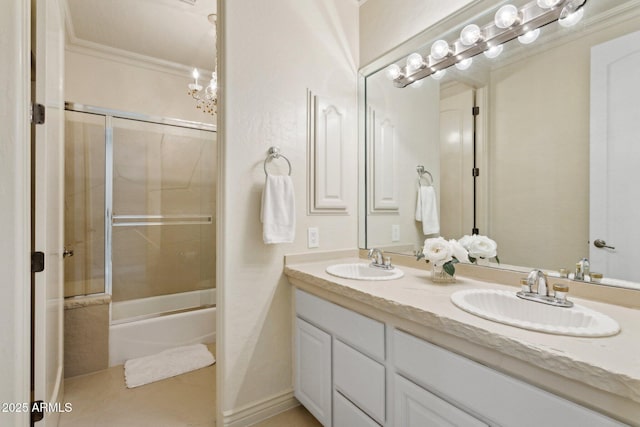 6467 E Sierra Vista Dr, Paradise Valley, AZ 85253 - bathroom featuring crown molding, a sink, double vanity, and bath / shower combo with glass door