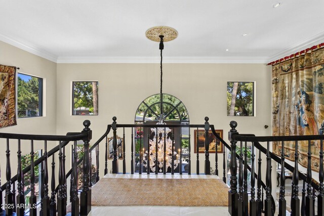 6467 E Sierra Vista Dr, Paradise Valley, AZ 85253 - corridor featuring an inviting chandelier, tile patterned floors, ornamental molding, and an upstairs landing