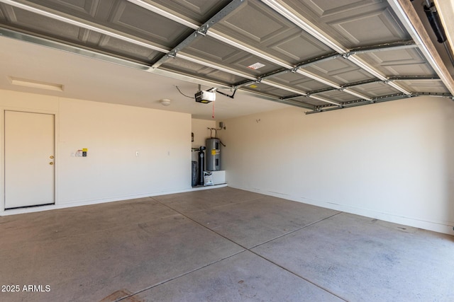 garage featuring water heater and a garage door opener