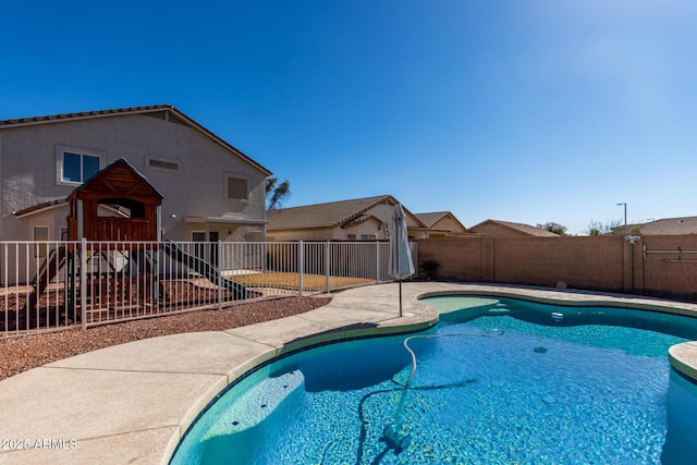 view of swimming pool featuring a patio, a fenced backyard, and a fenced in pool