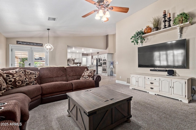 3203 E Ellis St, Mesa, AZ 85213 - living area with visible vents, ceiling fan, vaulted ceiling, and light carpet
