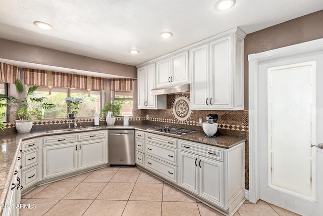 3203 E Ellis St, Mesa, AZ 85213 - kitchen featuring decorative backsplash, a sink, light tile patterned floors, white cabinets, and stainless steel appliances