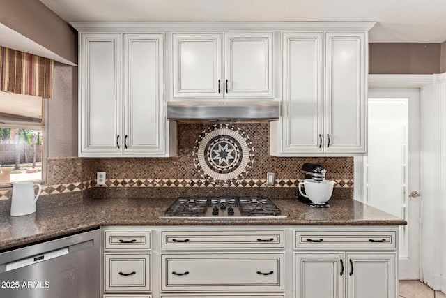 3203 E Ellis St, Mesa, AZ 85213 - kitchen with decorative backsplash, dark stone countertops, under cabinet range hood, and stainless steel appliances