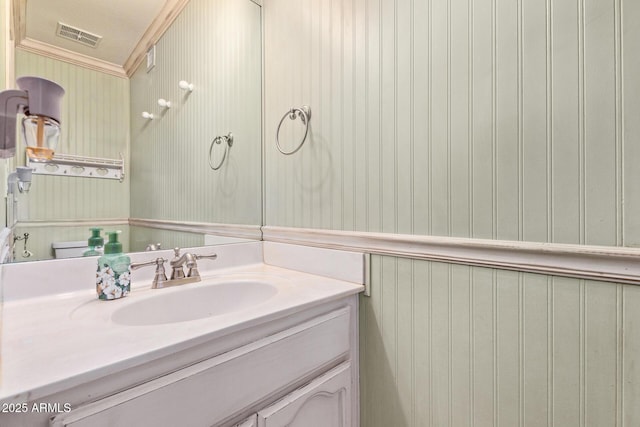 3203 E Ellis St, Mesa, AZ 85213 - bathroom featuring visible vents, ornamental molding, vanity, and wallpapered walls