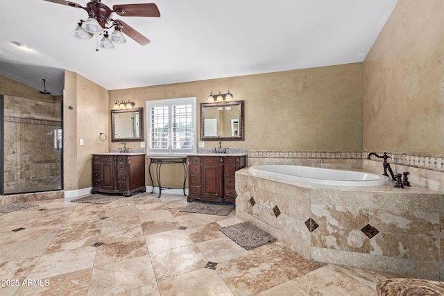 3203 E Ellis St, Mesa, AZ 85213 - full bath featuring ceiling fan, a bath, a stall shower, two vanities, and a sink