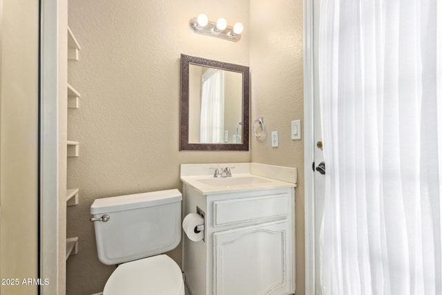 3203 E Ellis St, Mesa, AZ 85213 - bathroom with toilet, a textured wall, and vanity