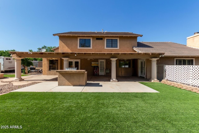 3203 E Ellis St, Mesa, AZ 85213 - back of house featuring a lawn, a patio area, and stucco siding
