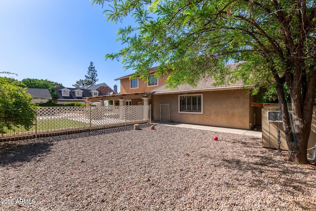 3203 E Ellis St, Mesa, AZ 85213 - rear view of house with fence, stucco siding, and a patio area
