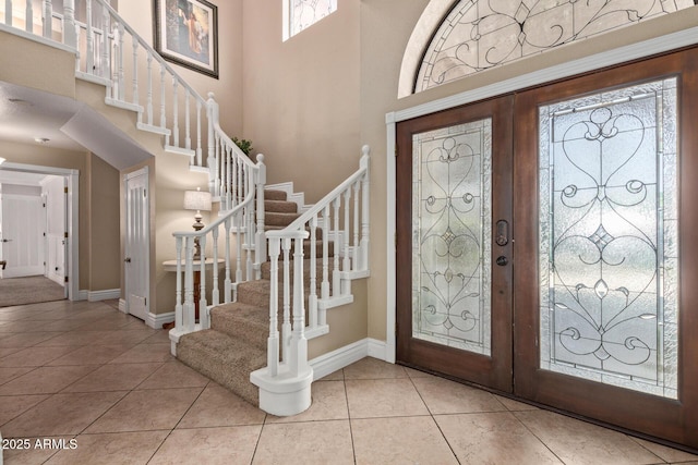 3203 E Ellis St, Mesa, AZ 85213 - tiled entryway with baseboards, a high ceiling, and stairway