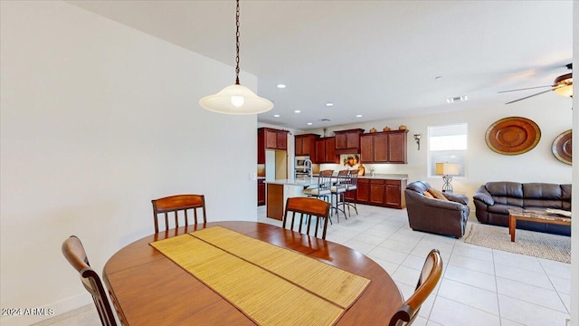 dining room featuring ceiling fan and light tile patterned floors