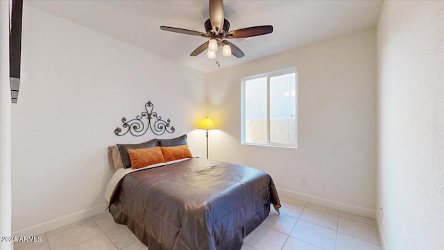 bedroom featuring ceiling fan and light tile patterned floors