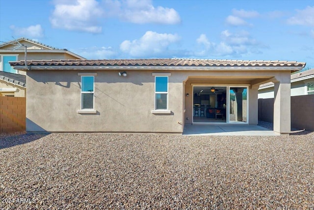 rear view of property featuring a patio area