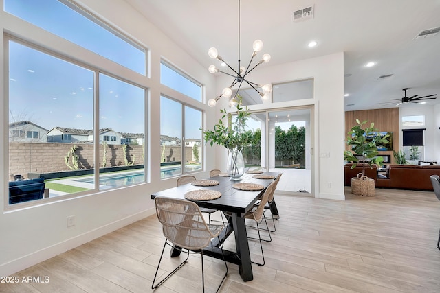 dining space featuring light wood-style flooring, visible vents, and recessed lighting