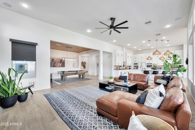 living room featuring recessed lighting, billiards, a ceiling fan, visible vents, and light wood finished floors