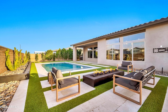 view of swimming pool featuring a fenced in pool, a fenced backyard, and a patio