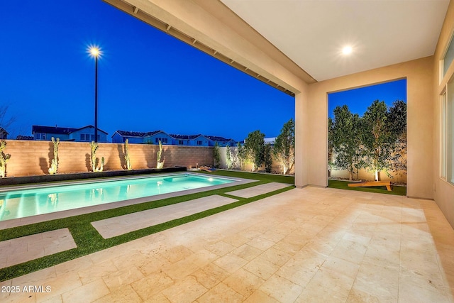 view of pool featuring a patio area, a fenced backyard, and a fenced in pool