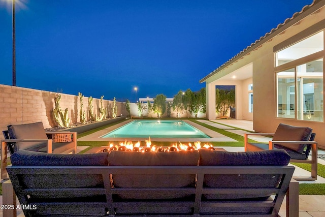 pool at twilight with a patio area, a fenced backyard, an outdoor living space, and a fenced in pool