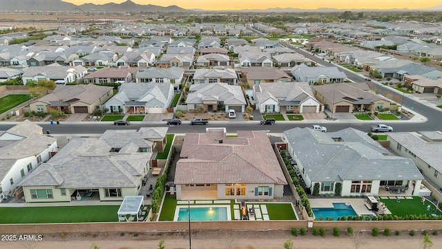 aerial view at dusk with a residential view and a mountain view