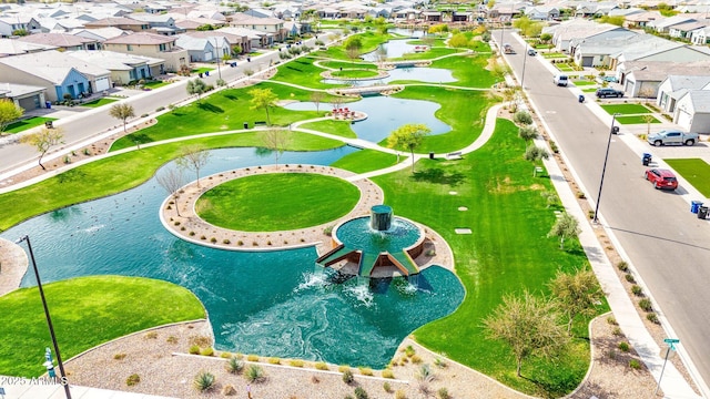 drone / aerial view with a water view and a residential view