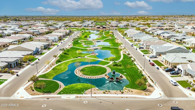 drone / aerial view with a residential view and a water view