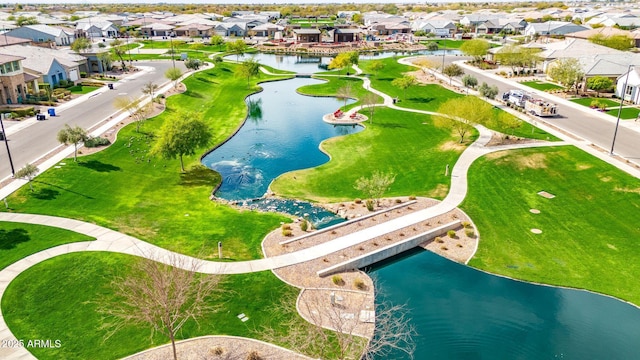 birds eye view of property featuring a residential view and a water view