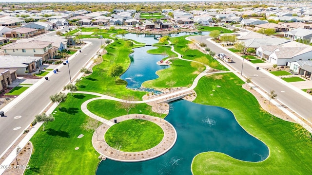 birds eye view of property featuring a water view and a residential view