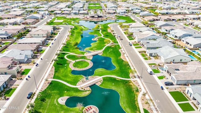 bird's eye view with a water view and a residential view