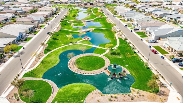 bird's eye view with a residential view and a water view