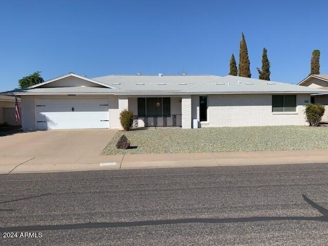 single story home featuring a garage