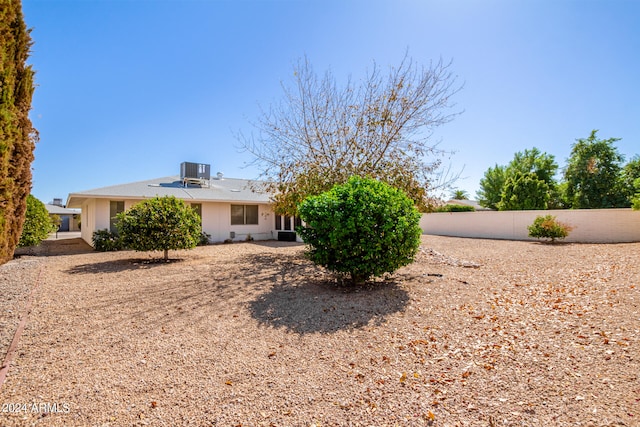 back of property with central AC unit