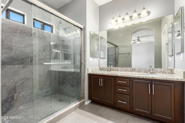 bathroom featuring vanity, tile patterned floors, ceiling fan, and a shower with shower door