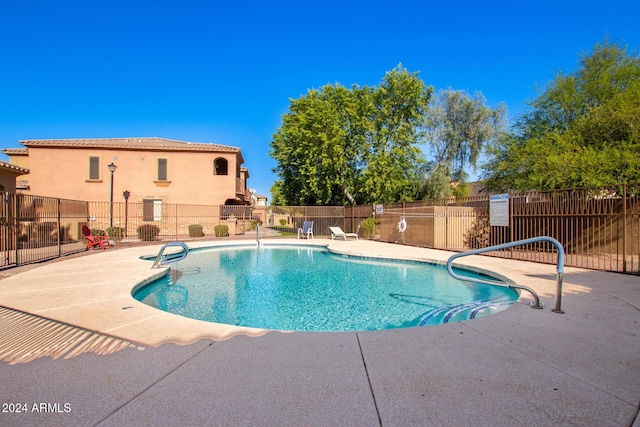 view of swimming pool featuring a patio