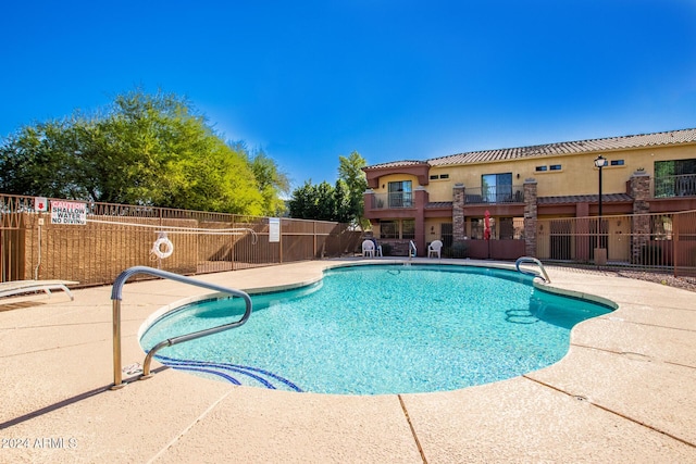 view of pool featuring a patio