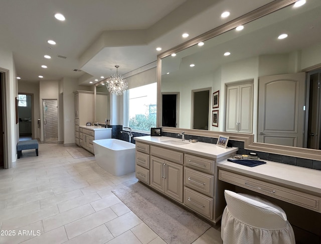 bathroom with backsplash, vanity, a notable chandelier, tile patterned floors, and shower with separate bathtub