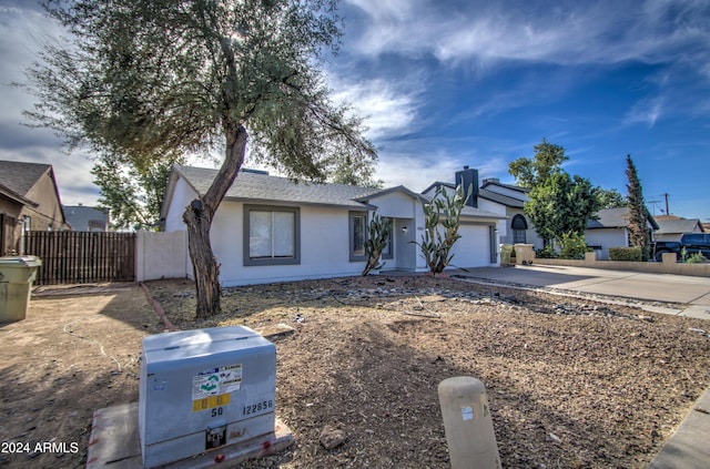 ranch-style home featuring a garage