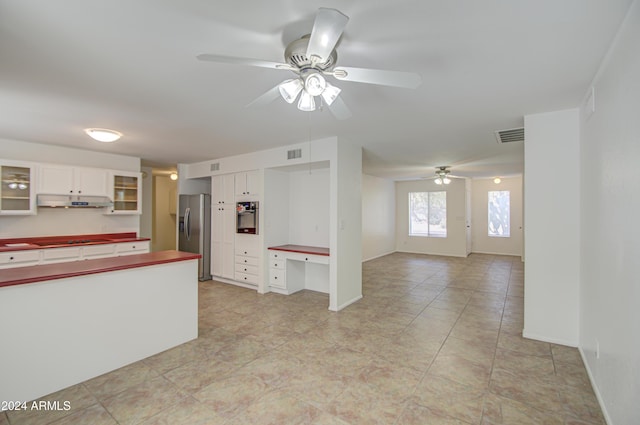 kitchen with ceiling fan, light tile patterned floors, white cabinetry, and appliances with stainless steel finishes