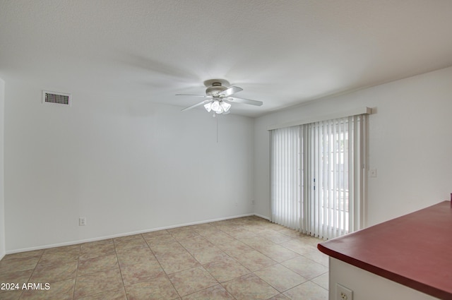 spare room with ceiling fan