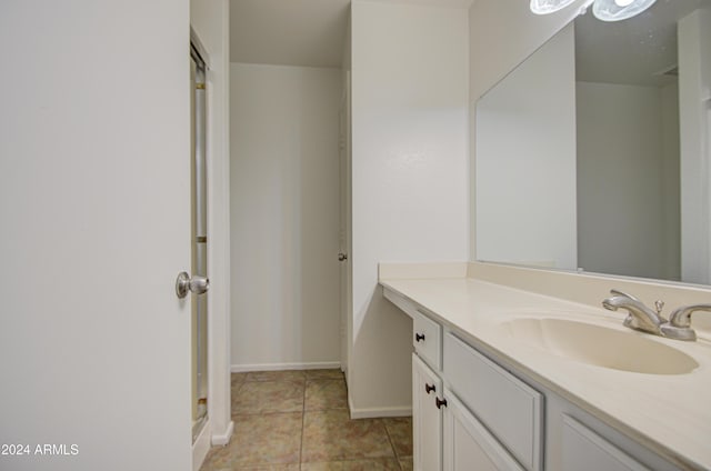 bathroom with tile patterned flooring and vanity