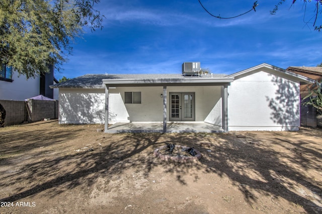 back of house featuring french doors, a patio, and central AC