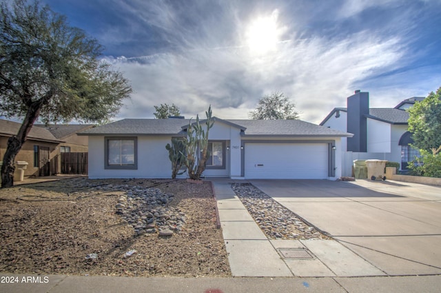 ranch-style home with a garage