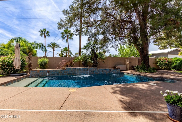 view of swimming pool featuring a fenced backyard and a patio area
